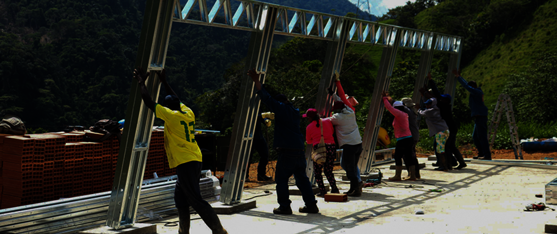 Raising a building frame in rural Colombia